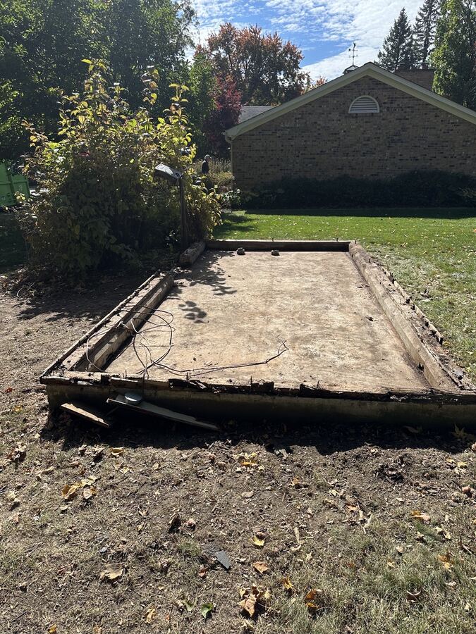 Bare concrete pad after the debris was hauled away