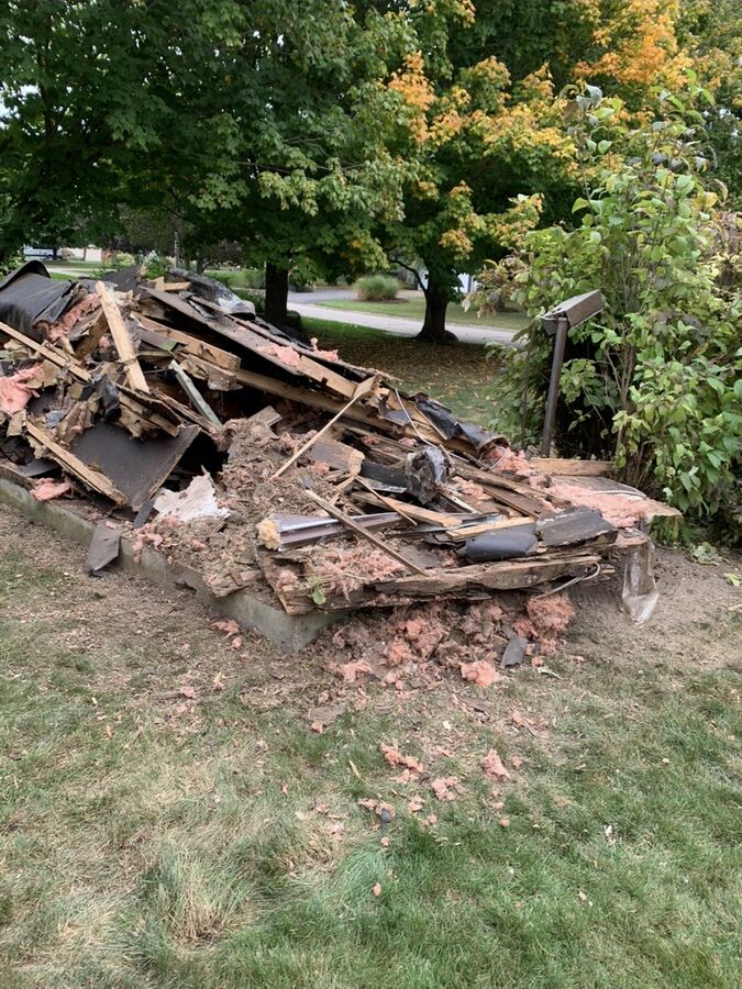 Pile of shed debris on a backyard pad
